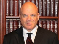 The Law Offices of Greg Prosmushkin, P.c. - Legal/Finance