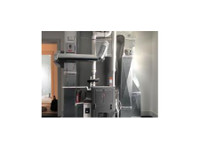Trusted Heating & Cooling Solutions (3) - Fontaneros y calefacción