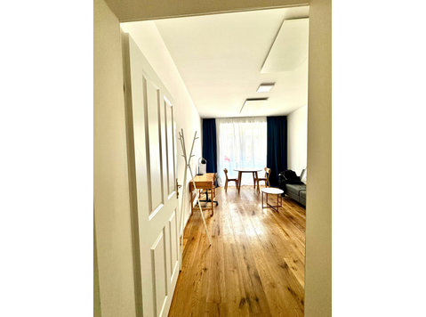 Charming garden apartment in a lively neighborhood - For Rent