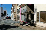 Shop with a mezzanine in a building complex in Paphos. 

It… - Casas