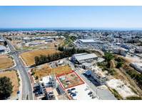 The property is an industrial plot in Agios Theodoros. 

It… - Hus