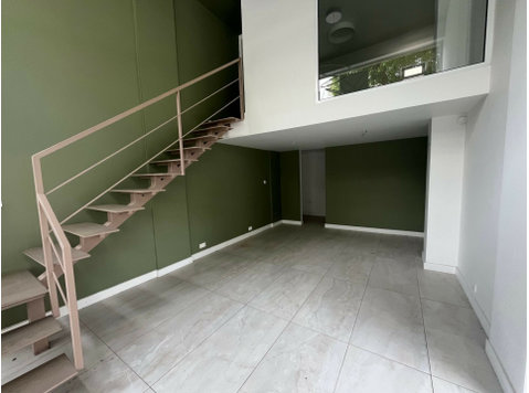 This modern shop, located on the ground floor in the… - Къщи