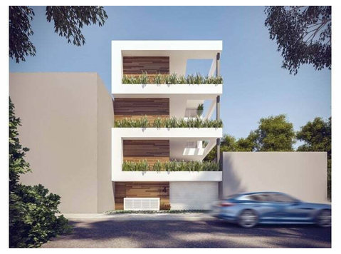 A 3-storey apartment block of six 2-bedroom apartments with… - Maisons
