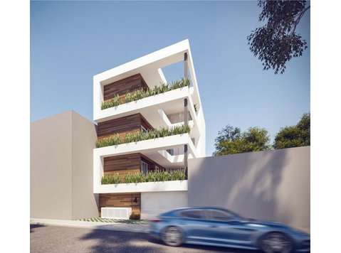 A 3-storey apartment block of six 2-bedroom apartments with… - Houses