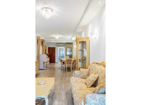 This charming and cozy two-bedroom apartment is located in…