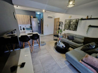 This modern one-bedroom apartment is located on the 1st… - Maisons