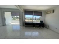 Nestled in central Paphos, this sleek two-bedroom apartment… - Majad