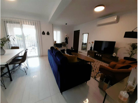 The apartment is designed with a focus on natural light and… - منازل