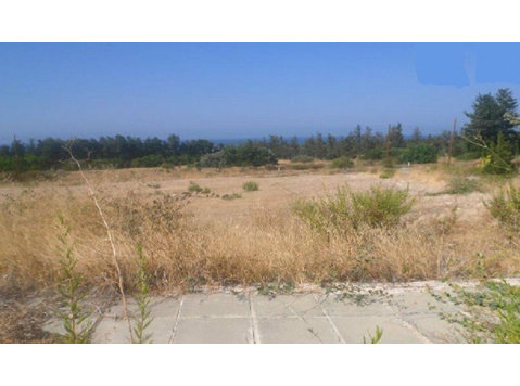 The property is a plot located in Kouklia village, Paphos… - Houses