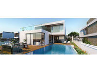 This beachfront villa features a private swimming pool,…