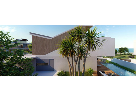 This is a luxurious 4-bedroom contemporary beachfront villa… - Nhà