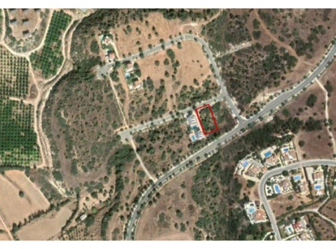 This plot is located in Kouklia, Paphos district.It has an… - Houses