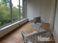 Comfortable apartment with a large winter garden - Asunnot
