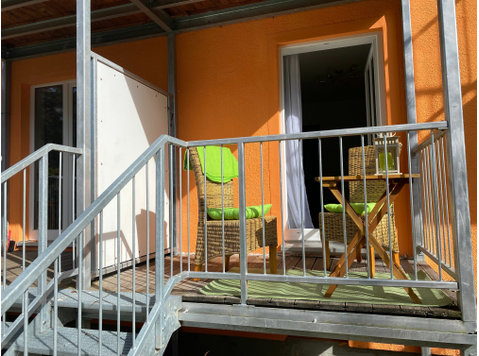 Modern but cozy apartment with a balcony by the stream,… - Aluguel
