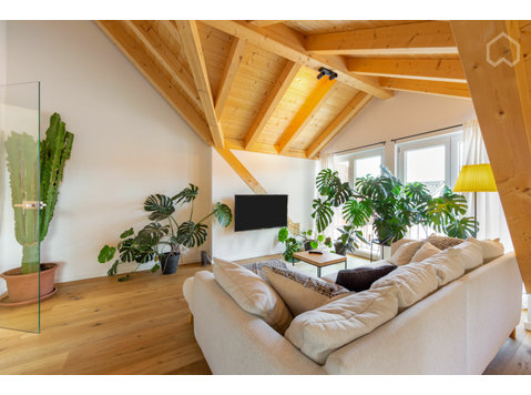 Awesome light-flooded three-room-flat with open roof truss… - Kiadó