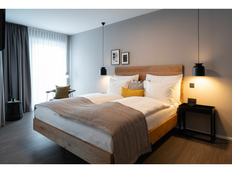 Modern longstay hotel room in Schwabing - your second home… - الإيجار