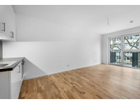 Unfurnished studio with a fitted kitchen in Lichtenberg