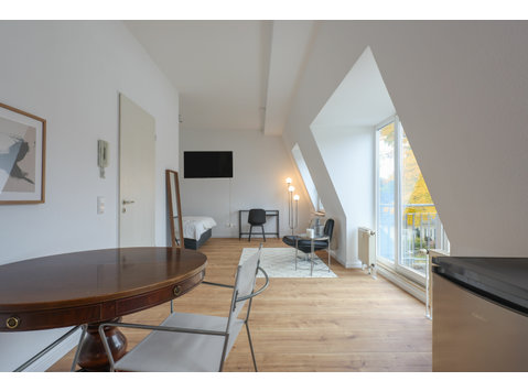 Furnished, quiet loft with balcony and underground parking - For Rent
