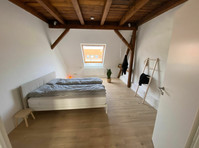 Very bright, loft-like 3-room attic apartment in Möckern - De inchiriat