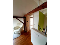 Charming apartment in converted barn in the pearl of Langen - Izīrē