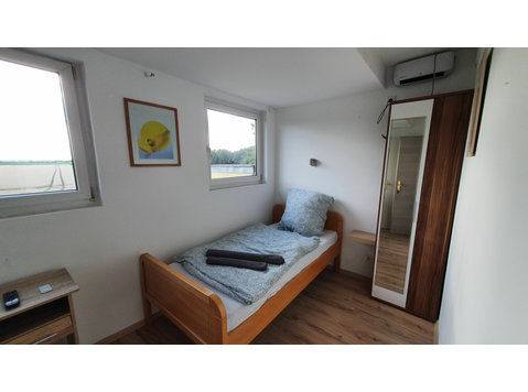 Apartment mit privatem Bad und Gemeinschaftsküche nahe… - Zu Vermieten