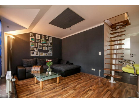 Stylish 2-room maisonette flat with top transport… - Annan üürile