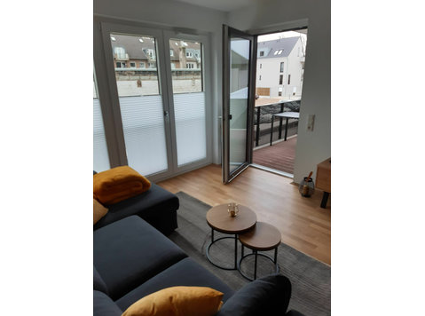 Neuwertige Wohnung + Balkon + Tiefgarage - Zu Vermieten