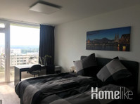 Excellently renovated apartment above the roofs of Cologne… - Asunnot