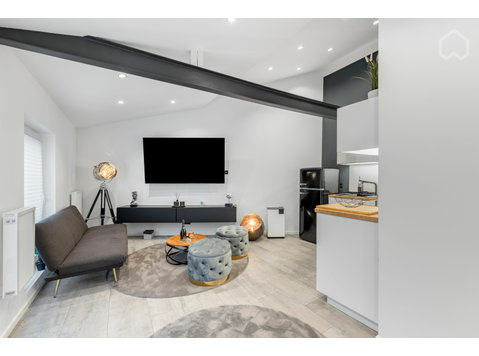 Exklusives Loftapartment im Erdgeschoss mit eigenem Garten… - Disewakan
