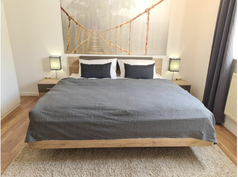 Bright & modern apartment near the train station in a… - For Rent