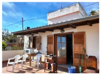 Traditional house on two floors with courtyard and garden.