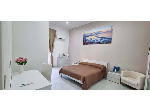 Stanza con bagno privato - Apartments