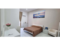 Stanza con bagno privato - Asunnot