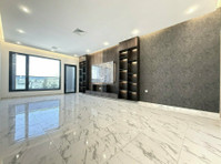 Bayan – great, unfurnished three bedroom apartment w/balcony