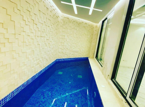 Beautiful 4 bedrooms villa apt w/private pool in abu fatira - 	
Lägenheter