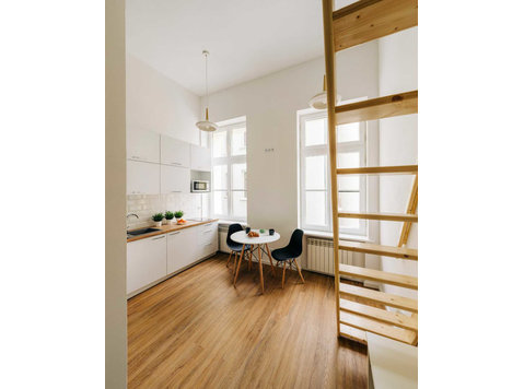 Modern studio apartment with bed - Apartments