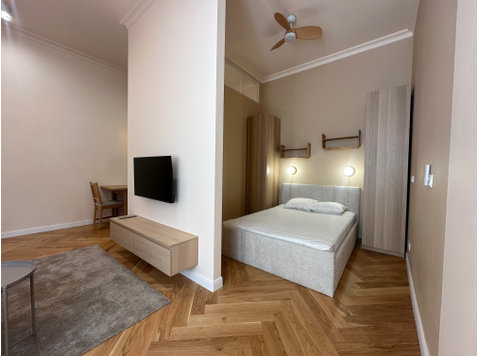 Studio with a bedroom  area on 1 Maja 11 street - Apartments