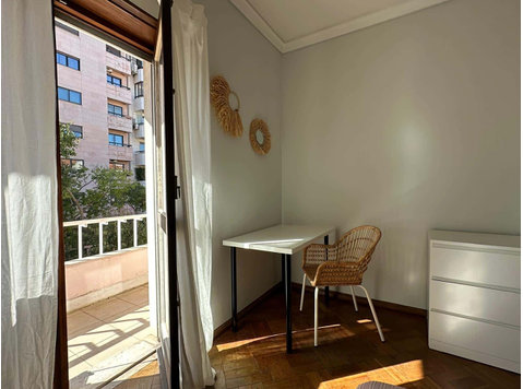 Bright bedroom with balcony. R4 - Apartments