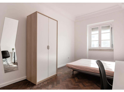 Quarto com cama de casal em apartamento com 7 quartos -… - Apartments
