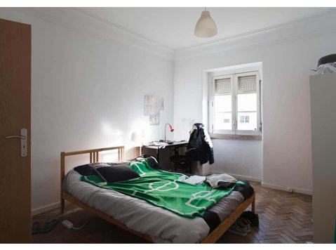 Quarto com cama de casal em apartamento com 7 quartos F07 -… - Apartments