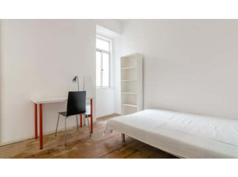 Quarto com duas camas de solteiro em apartamento com 9… - Apartman Daireleri