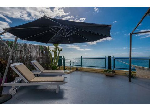 Flatio - all utilities included - Sea Breeze Beach Penthouse - For Rent