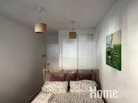 Modern apartment with large terrace in the foothills of the… - Apartamente