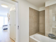 Central Geneva Apartment with Modern Amenities - Apartments