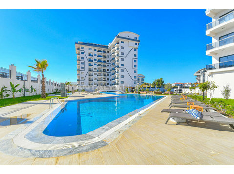 Apartment with Sea View in Faralya Complex in Alanya - Housing