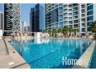 Stylish City Haven: Modern Luxury Apartment in Dubai - Apartemen