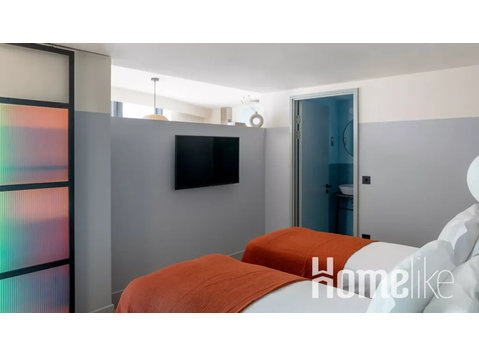 Studio-Apartment mit zwei Einzelbetten in einer urbanen Oase - Wohnungen