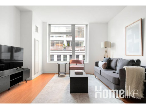 Deluxe Downtown 1BR w/ Gym & W/D, near South Station - 	
Lägenheter